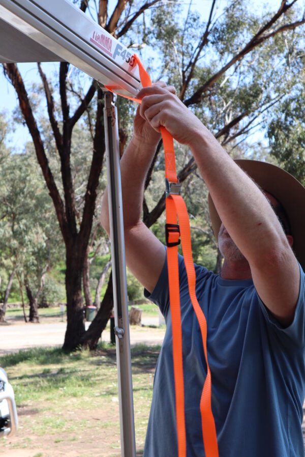 HI VIs Orange tie down straps in use on awning