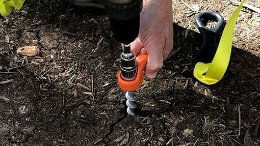 Drill the Ground Dog screw in peg into the ground using a 19mm socket, and a left thread setting
