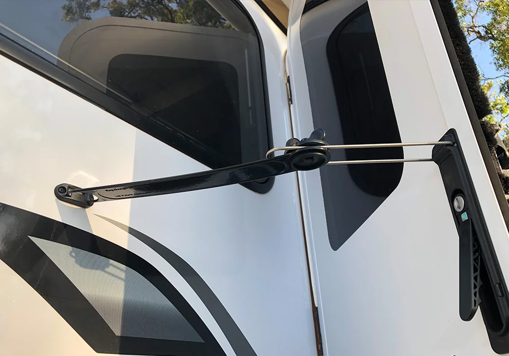 Door latch extension for caravans