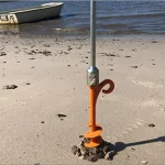 In place of drill, a hand crank can be used for screw in sand pegs